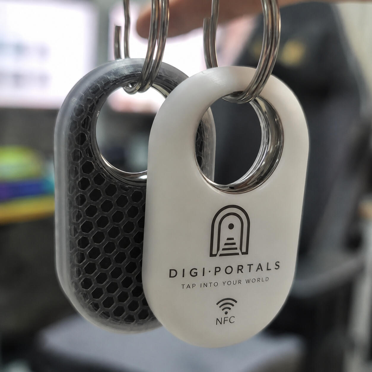 Two DigiPortals NFC keychain tags
